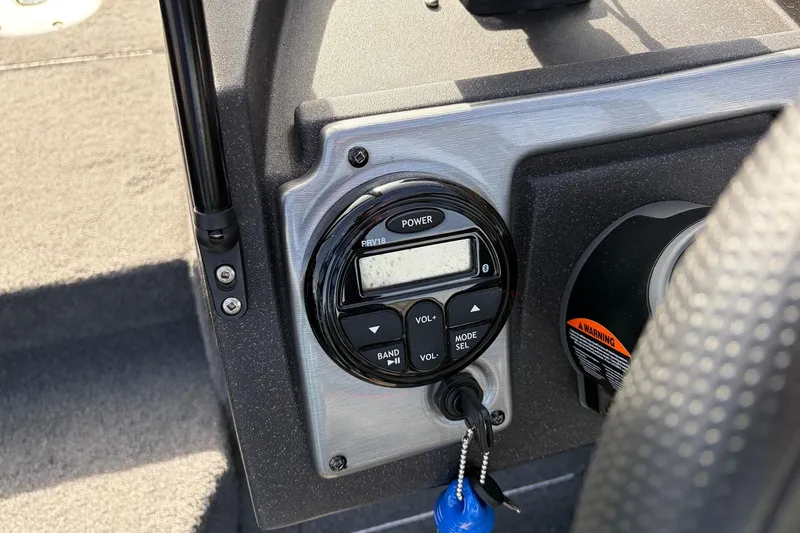 Slide: The Image of Control panel of 2022 Tracker Pro Guide V-175 Combo boat with key and warning label. - 29