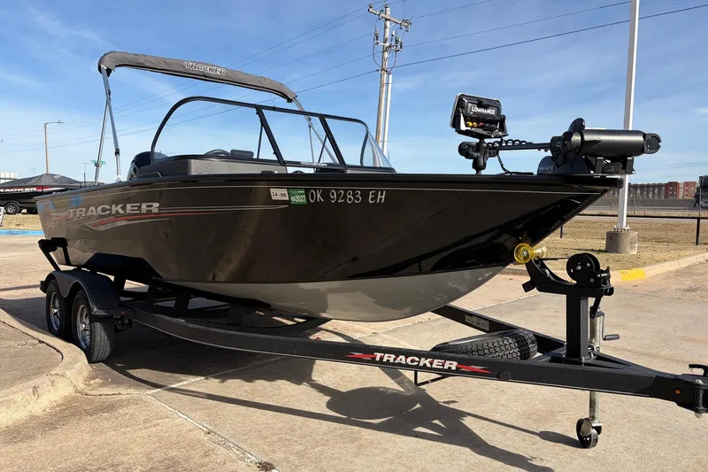 Slide: The Image of 2022 Tracker Pro Guide V-175 Combo boat on trailer, parked outdoors. - 3
