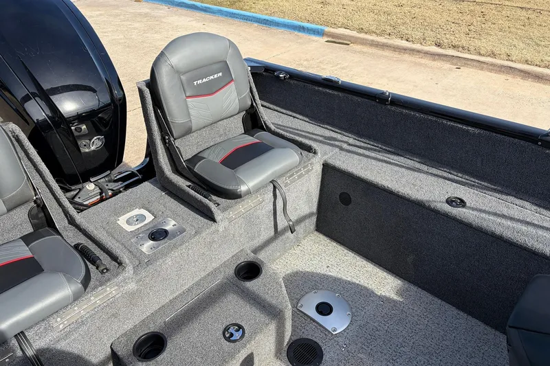 Slide: The Image of 2022 Tracker Pro Guide V-175 Combo boat interior with gray seating and motor. - 33