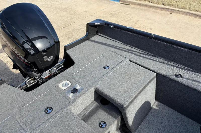 Slide: The Image of 2022 Tracker Pro Guide V-175 Combo boat interior with motor, showcasing spacious deck design. - 35