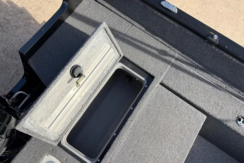 Slide: The Image of 2022 Tracker Pro Guide V-175 Combo boat with open storage compartment. - 38