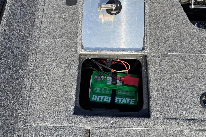 Slide: The Image of Battery compartment of 2022 Tracker Pro Guide V-175 Combo boat with Interstate battery. - 41