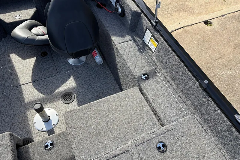 Slide: The Image of 2022 Tracker Pro Guide V-175 Combo boat interior with seating and storage compartments. - 42