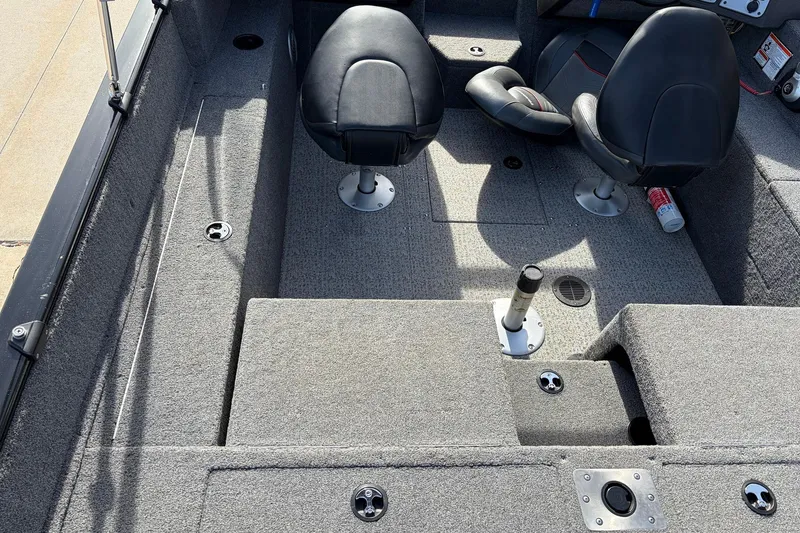 Slide: The Image of 2022 Tracker Pro Guide V-175 Combo boat interior with seating and carpeted flooring. - 44