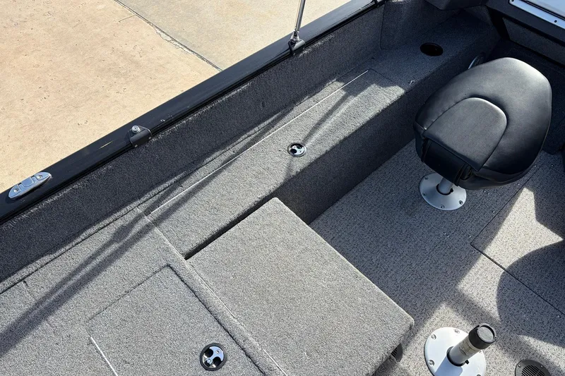 Slide: The Image of 2022 Tracker Pro Guide V-175 Combo boat interior with seating and storage compartments. - 45