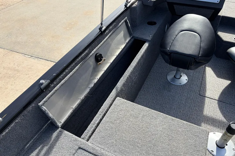 Slide: The Image of 2022 Tracker Pro Guide V-175 Combo boat interior with storage compartment and seating. - 46