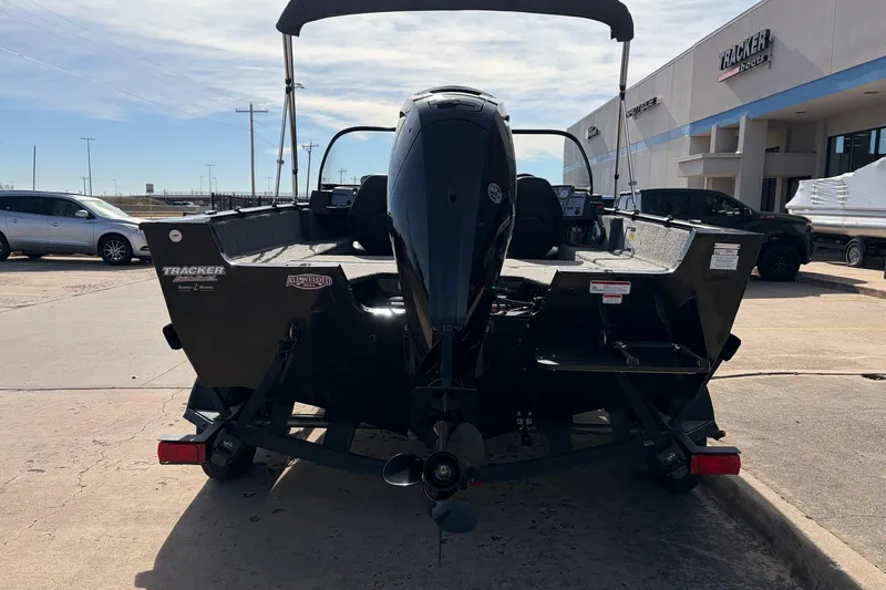 Slide: The Image of 2022 Tracker Pro Guide V-175 Combo boat, rear view at dealership. - 6