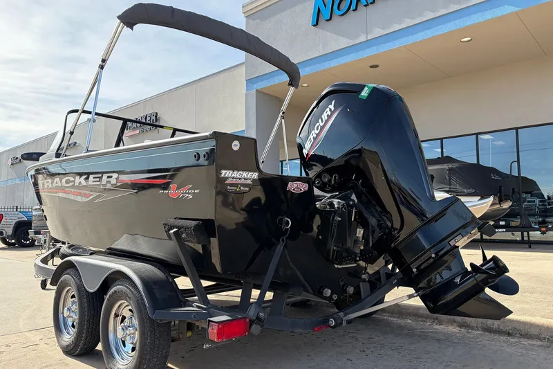 Slide: The Image of 2022 Tracker Pro Guide V-175 Combo boat with Mercury engine on trailer. - 7
