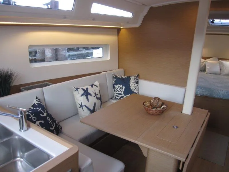 Slide: The Image of Interior of 2024 Jeanneau 380 sailboat with dining area and modern decor. - 20