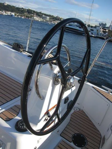 Slide: The Image of Steering wheel of a 2024 Jeanneau 380 sailboat on a sunny day. - 37