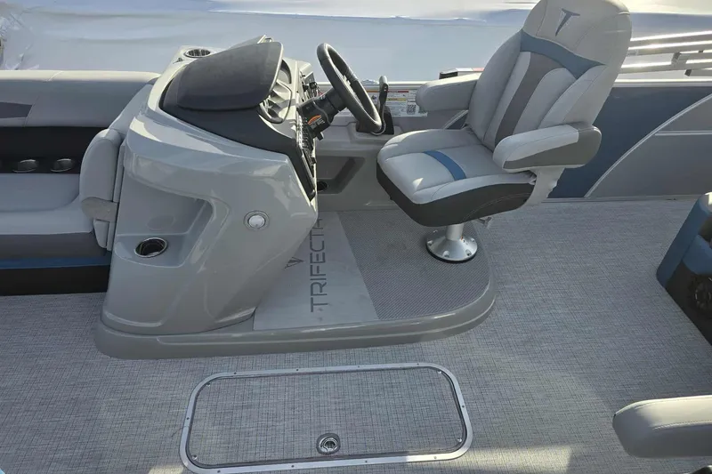 Slide: The Image of Interior of 2026 Trifecta 24ULCS3 boat with modern helm and captain's chair. - 12