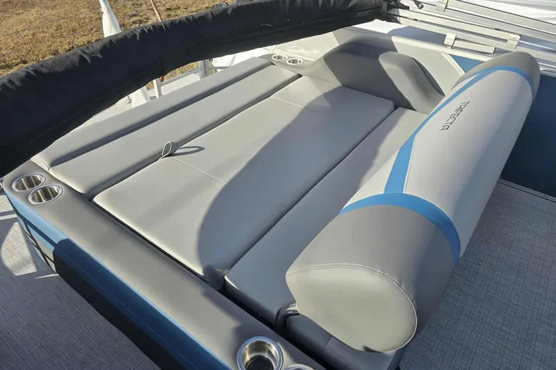 Slide: The Image of Luxurious seating on 2026 Trifecta 24ULCS3 pontoon boat with cup holders and sleek design. - 15