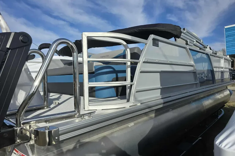 Slide: The Image of 2026 Trifecta 24ULCS3 pontoon boat with sleek design and modern features. - 2