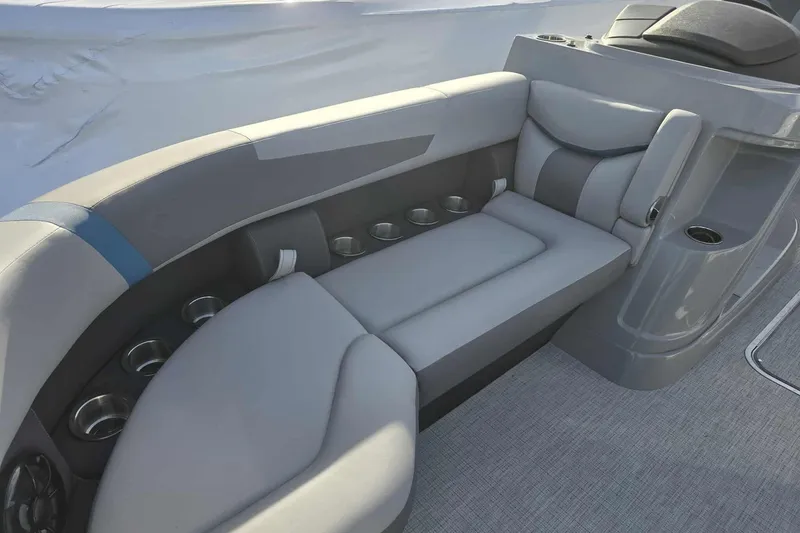 Slide: The Image of Luxurious seating on 2026 Trifecta 24ULCS3 boat, featuring sleek gray upholstery and integrated cup holders. - 8