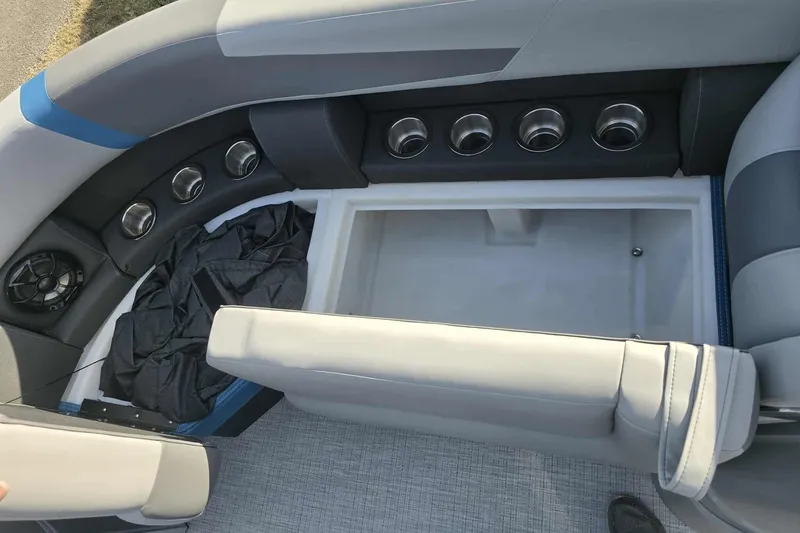Slide: The Image of Interior of 2026 Trifecta 24ULCS3 boat with seating and cup holders. - 9