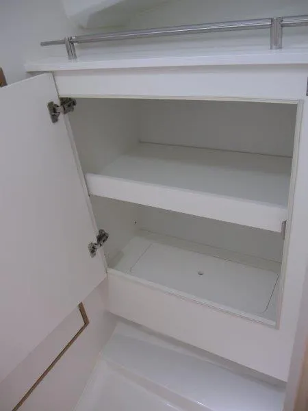 Slide: The Image of 2025 Jeanneau Sun Odyssey 350 interior cabinet with open shelves and sleek design. - 21