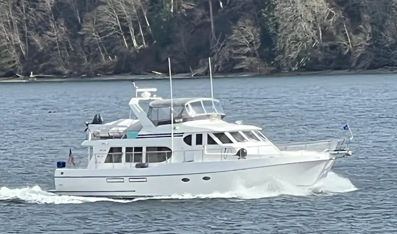 The Image of 1999 Ocean Alexander 510 Pilothouse cruising on calm waters. - 0