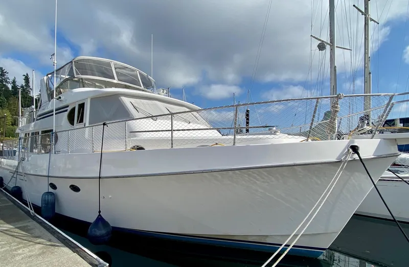 Slide: The Image of 1999 Ocean Alexander 510 Pilothouse yacht docked at marina. - 11