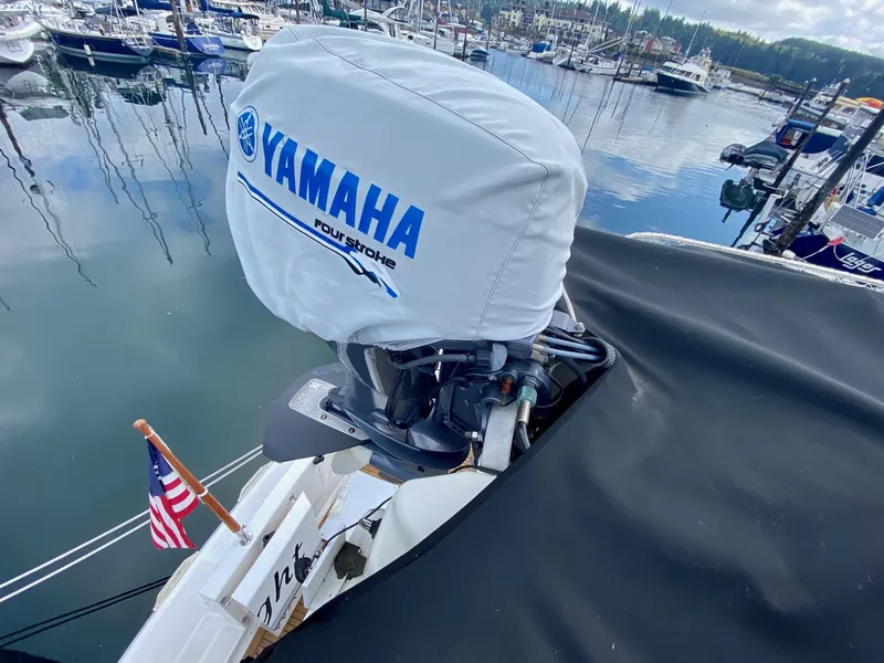 Slide: The Image of Yamaha outboard motor on 1999 Ocean Alexander 510 Pilothouse in harbor. - 34