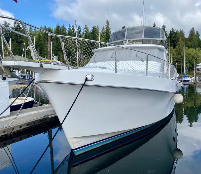 Slide: The Image of 1999 Ocean Alexander 510 Pilothouse docked, calm waters. - 4