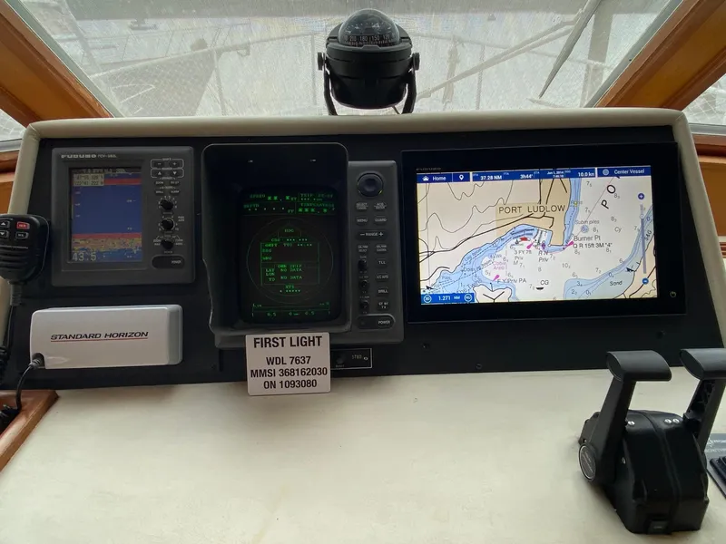 Slide: The Image of 1999 Ocean Alexander 510 Pilothouse helm with navigation system. - 43