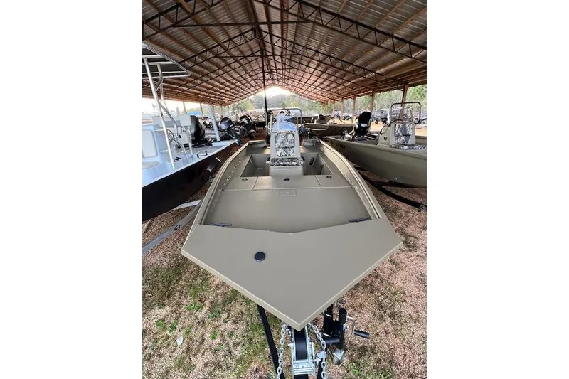 The Image of 2026 G3 Gator Tough 17 CC boat under a metal canopy, front view. - 1