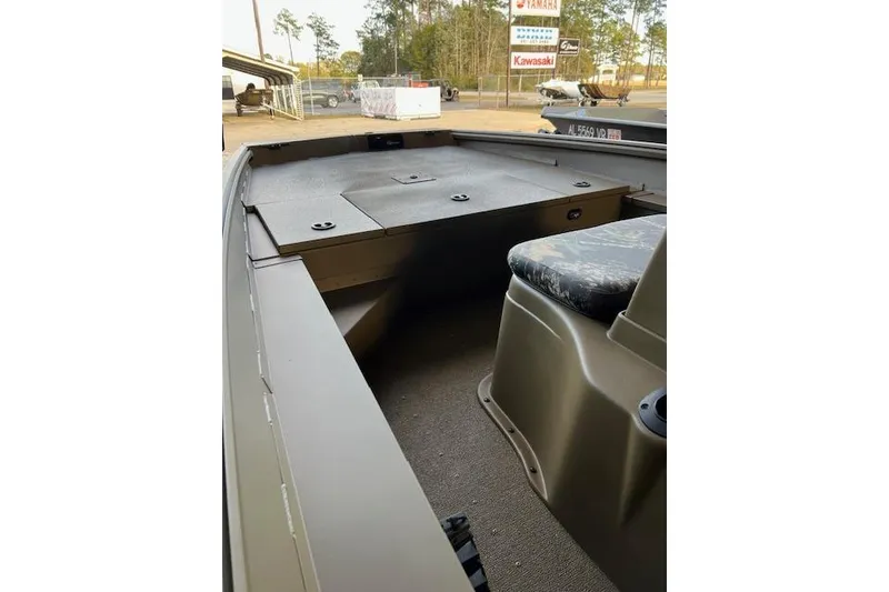 Slide: The Image of 2026 G3 Gator Tough 17 CC boat interior with seating and storage compartments. - 3