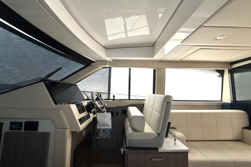 Slide: The Image of Interior of 2022 Regal 38 XO yacht with modern helm and seating area. - 17