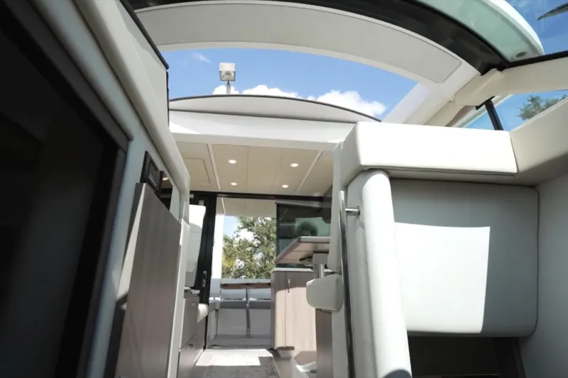 Slide: The Image of Interior view of 2022 Regal 38 XO yacht with modern design and skylight. - 23