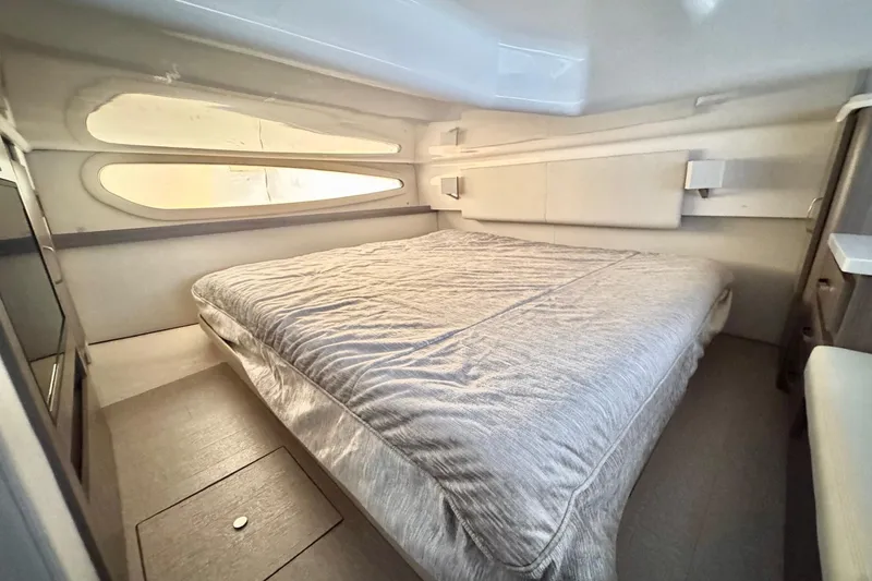 Slide: The Image of 2022 Regal 38 XO yacht interior cabin with a comfortable bed and modern design. - 25