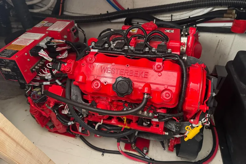 Slide: The Image of Red Westerbeke engine in 2022 Regal 38 XO boat, detailed wiring visible. - 30