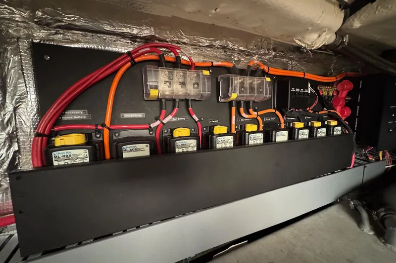 Slide: The Image of Electrical panel of a 2022 Regal 38 XO boat with wiring and components. - 33