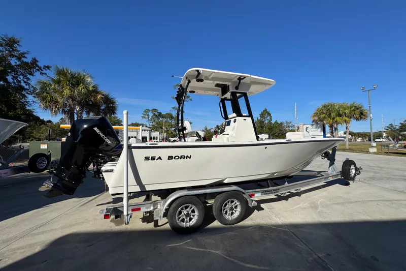 Slide: The Image of 2026 Sea Born LX231 Center Console boat on trailer, outdoor display. - 11