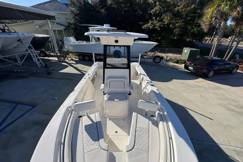 Slide: The Image of 2026 Sea Born LX231 Center Console boat in a sunny outdoor setting. - 22