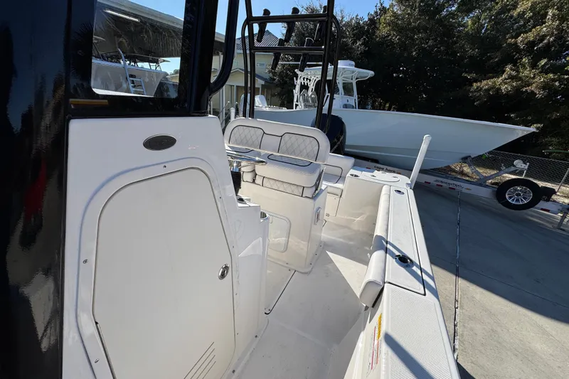 Slide: The Image of 2026 Sea Born LX231 Center Console boat, sleek design, spacious deck, outdoor setting. - 24