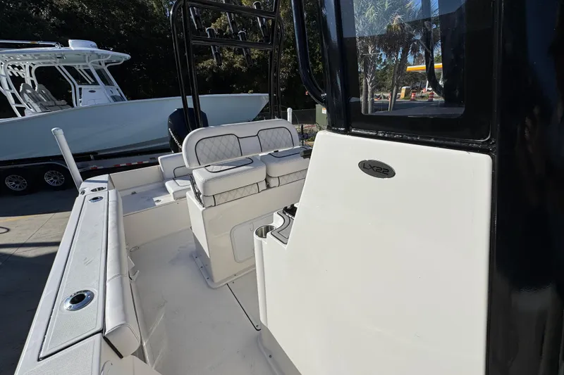 Slide: The Image of 2026 Sea Born LX231 Center Console boat interior with seating and console details. - 25