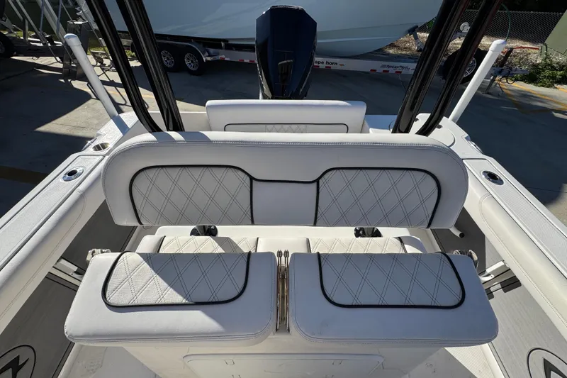 Slide: The Image of 2026 Sea Born LX231 Center Console boat interior with cushioned seating and sleek design. - 27