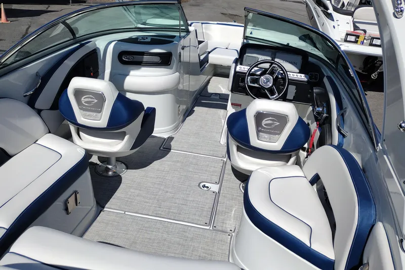 Slide: The Image of Interior of 2026 Crownline 260 XSS boat with modern seating and steering wheel. - 10
