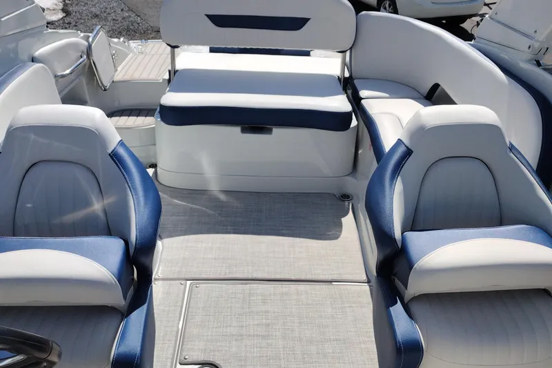 Slide: The Image of 2026 Crownline 260 XSS boat interior with blue and white seating. - 13