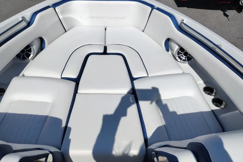 Slide: The Image of 2026 Crownline 260 XSS boat interior with white and blue cushioned seating. - 15