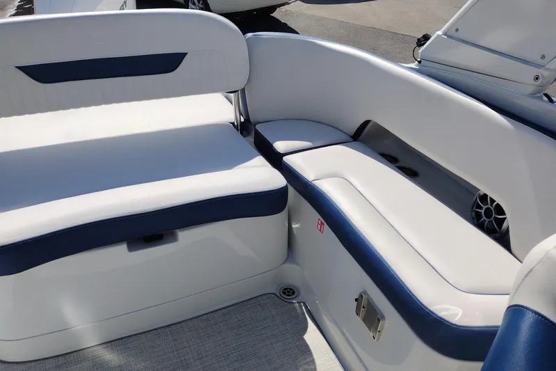Slide: The Image of 2026 Crownline 260 XSS boat interior with white and blue seating. - 21