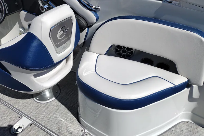 Slide: The Image of 2026 Crownline 260 XSS boat interior with blue and white seating and speaker system. - 22