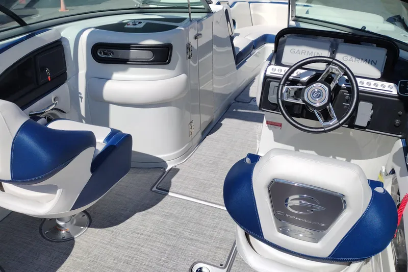 Slide: The Image of Interior of 2026 Crownline 260 XSS boat with modern steering and seating. - 23