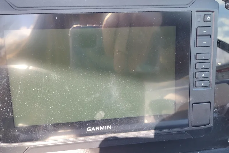Slide: The Image of Garmin display on 2026 Crownline 260 XSS boat dashboard, showing control buttons. - 25