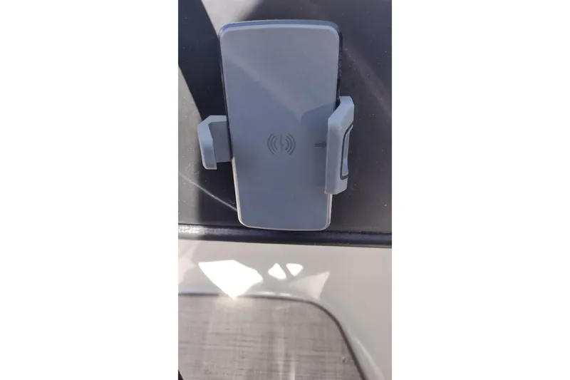 Slide: The Image of Phone holder on 2026 Crownline 260 XSS boat dashboard. - 27