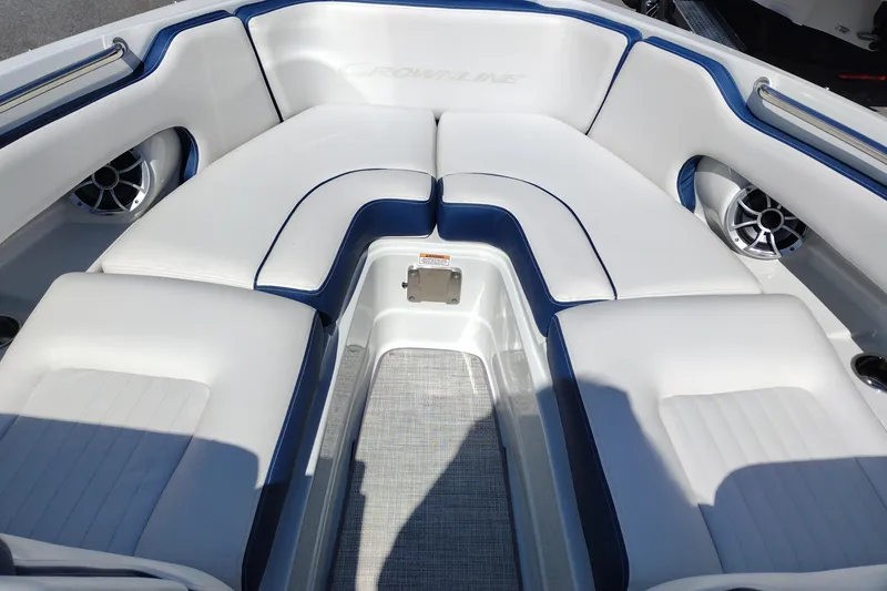 Slide: The Image of 2026 Crownline 260 XSS boat interior with white and blue seating. - 28