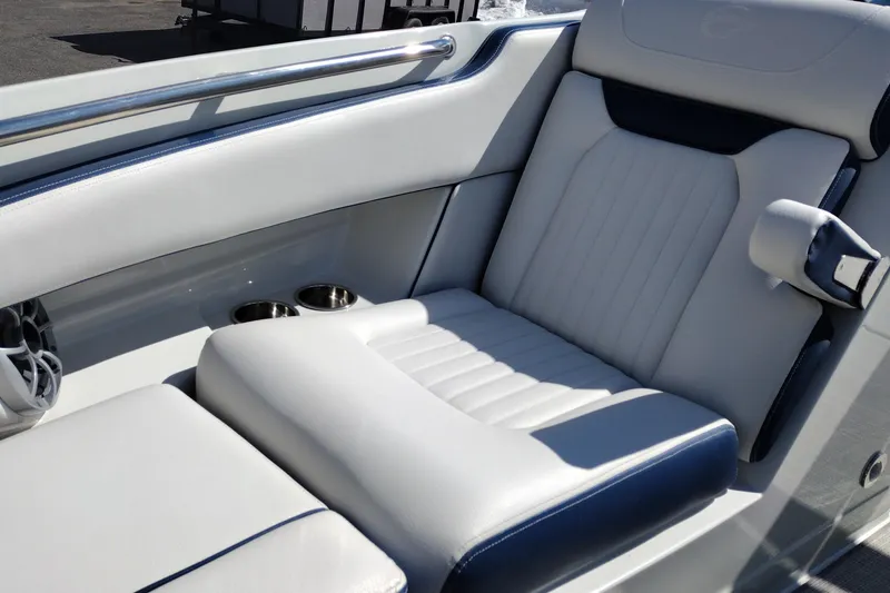 Slide: The Image of Luxurious seating in the 2026 Crownline 260 XSS boat, featuring cup holders and sleek design. - 29