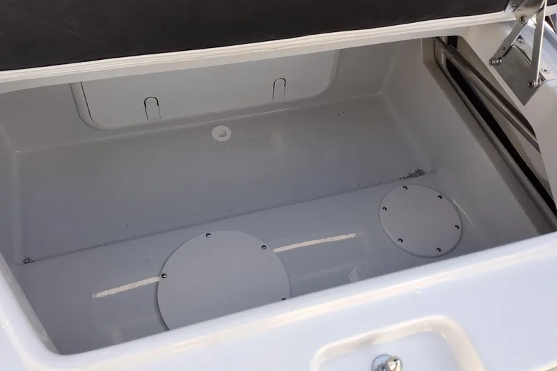 Slide: The Image of Storage compartment of 2026 Crownline 260 XSS boat, featuring a clean, spacious interior. - 32