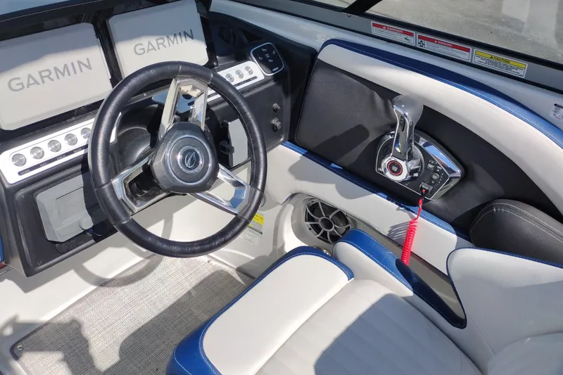 Slide: The Image of 2026 Crownline 260 XSS boat cockpit with Garmin displays and steering wheel. - 37