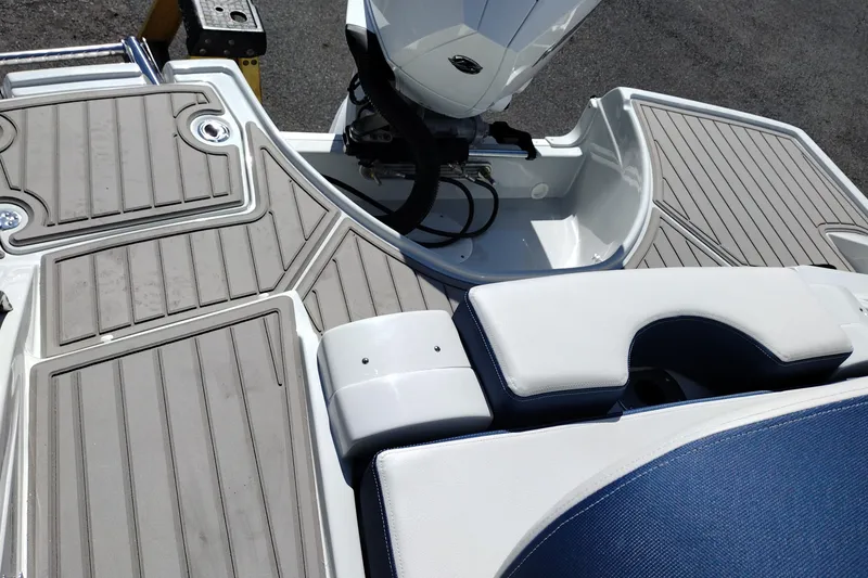Slide: The Image of 2026 Crownline 260 XSS boat deck with cushioned seating and motor area. - 39